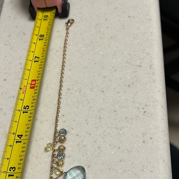 Earrings and necklace matching set. Clear blue & lime gems with gold-tone metal. - Picture 2 of 7